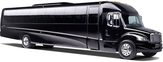 Large black Freightliner executive coach bus with extended body and dark tinted windows against a white background.